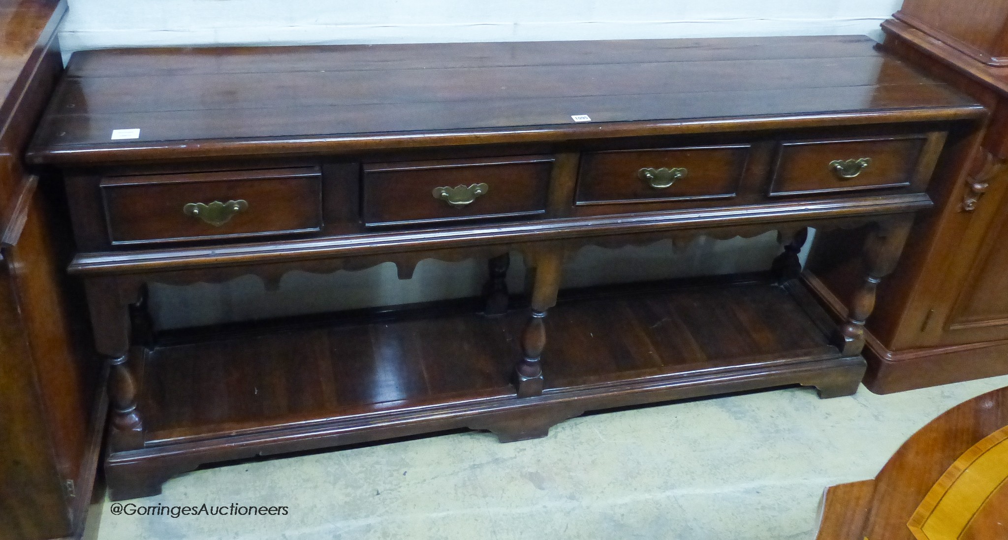 A reproduction 18th century style oak pot board low dresser. W-182, D-41, H-85cm.